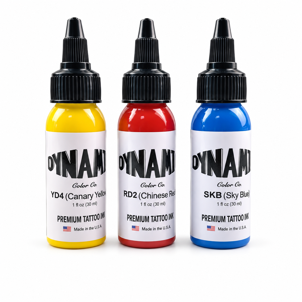 Yellow, red and blue 30ml tattoo ink bottles on a white background